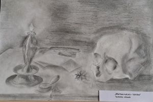 praca przedstawiająca czaszkę i świecę